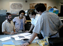 picture of students and instructors working in the lab