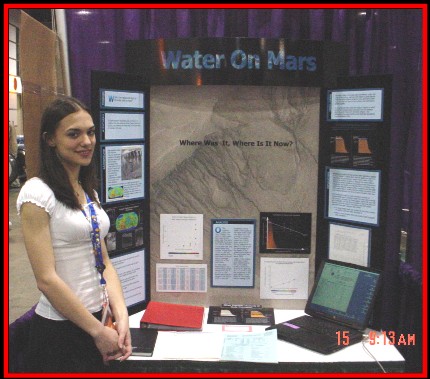 Picture of Erin Frey in front of her fair display