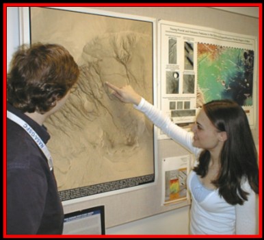picture of Erin Frey discussing Mars gullies with Dr. Susan Sakimoto